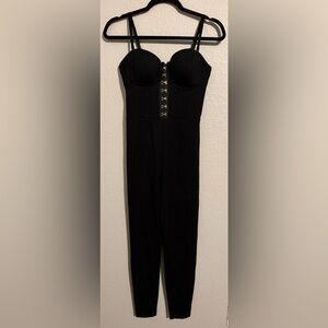 Guess Black Jumpsuit with Silver clasps. Size small